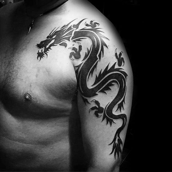 Black Ink Upper Arm Tribal Dragon Tattoo Design Idea For Men
