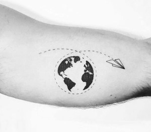 Black & White Globe With Paper Plane Tattoo On Bicep