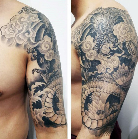 Black & White Ink Drragon and Flowers Tattoo On Men Half Sleeve