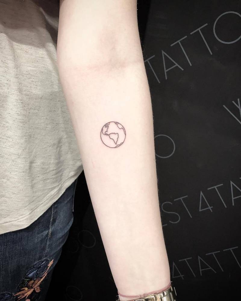 Black and white outlined small earth tattoo on girl inner forearm