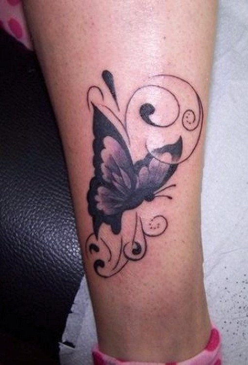 Black butterfly tattoo design on leg