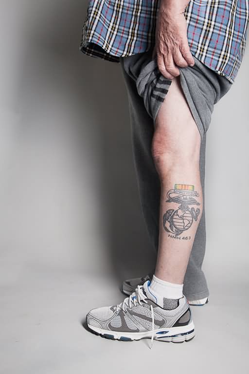Black globe, eagle and anchor tattoo on left leg for men