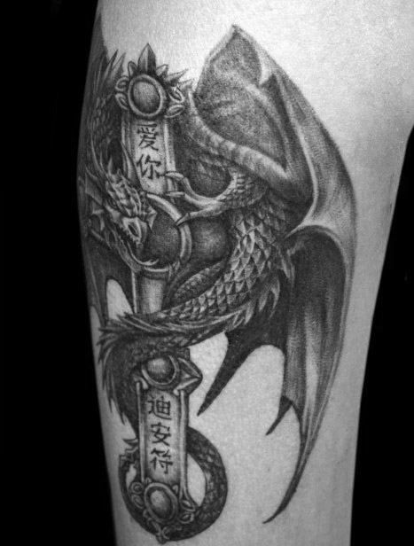 Black Gothic dragon tattoo on arm