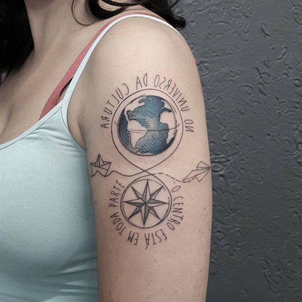 Black infinity lobe and paper airplane tattoo with compass and ship on left upper sleeve