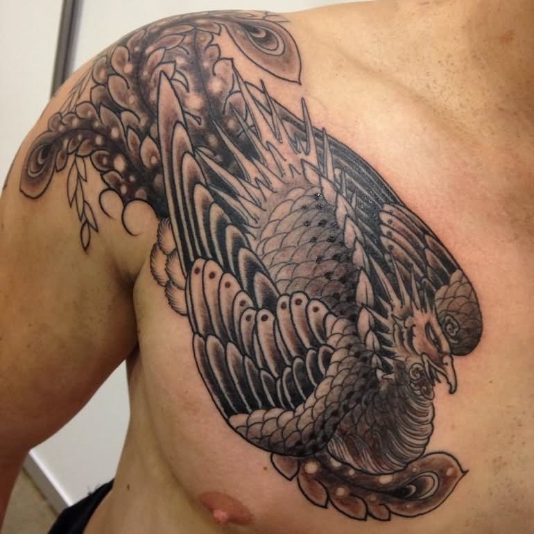 Black ink phoenix male chest & Shoulder tattoo