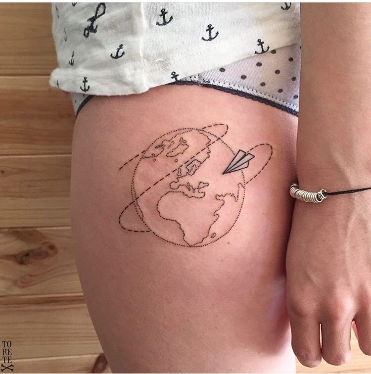 Black outline globe and paper airplane on left side of thigh for women