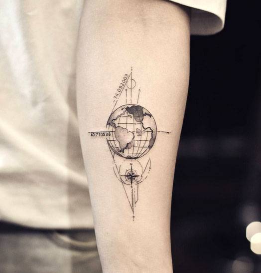 Black outlined and shaded earth tattoo with grid on sleeve