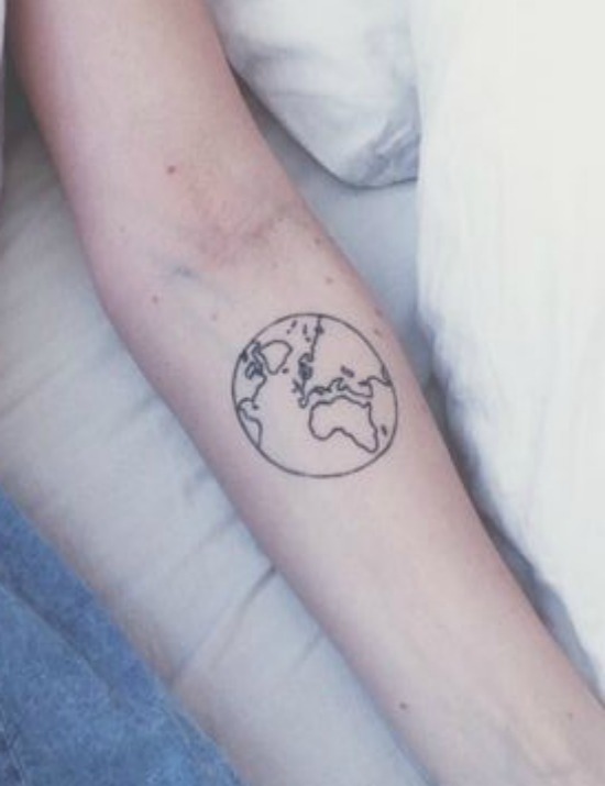 Black outlined earth tattoo on inner lower sleeve