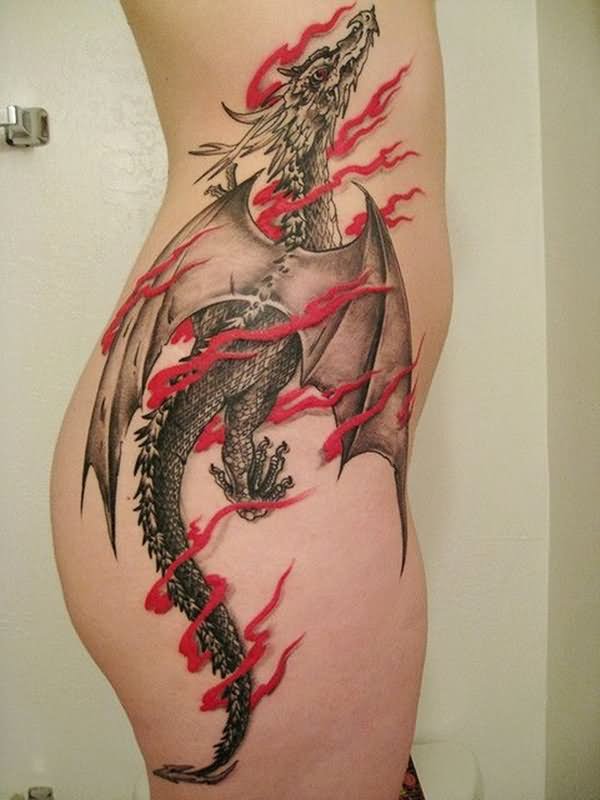 Black rising dragon in red flames tattoo on right leg and waist