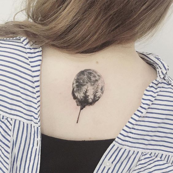 Black shaded earth tree tattoo on upper mid back