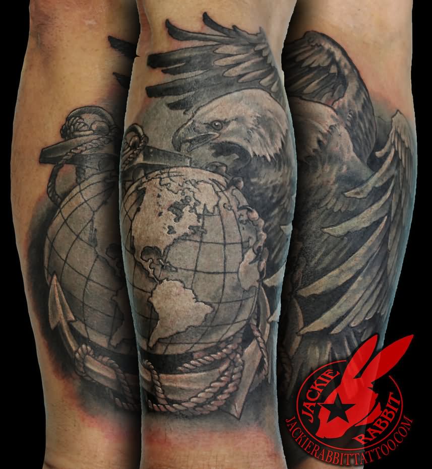 Black shaded globe, eagle and anchor tattoo on arm by Jackie Rabbit