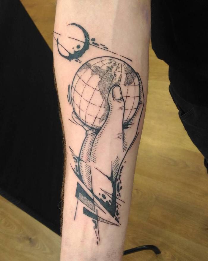 Black sketched earth on hand tattoo with moon on arm