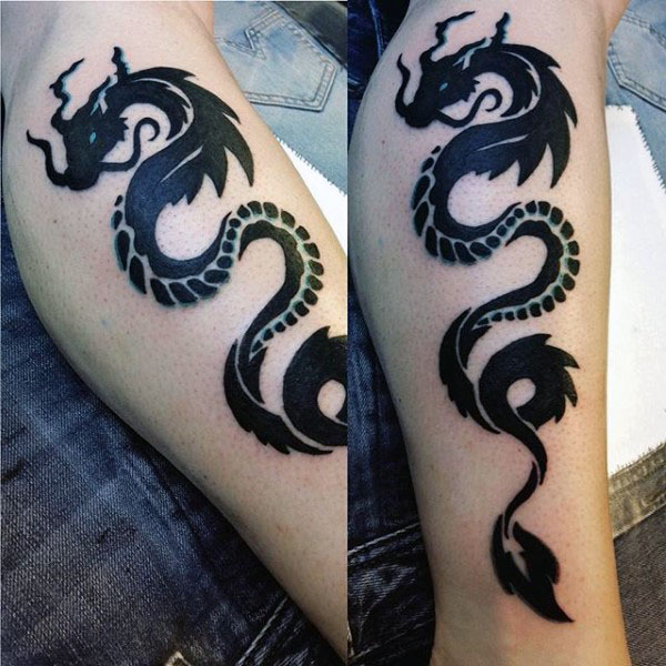 Black spiral snake tribal dragon tattoo on inner forearm for men