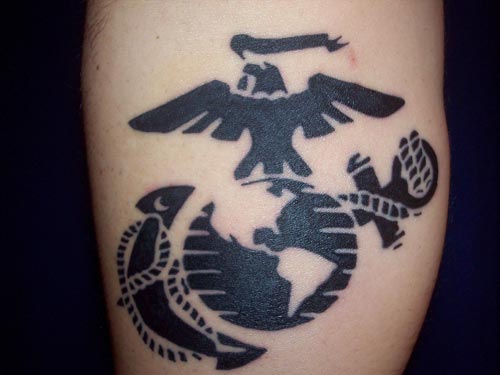 Black tribal globe, eagle and anchor tattoo on arm for men