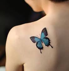 Blue and black buttterfly tattoo on left back shoulder