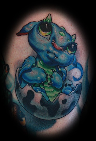 Blue and green baby dragon tattoo with egg on body