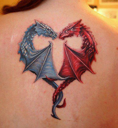 Blue and red dragon heart tattoo on the upper mid back