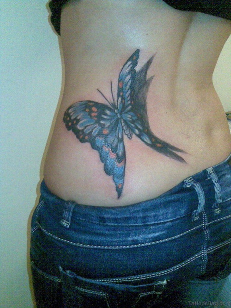 Blue butterfly tattoo on girl’s left lower back