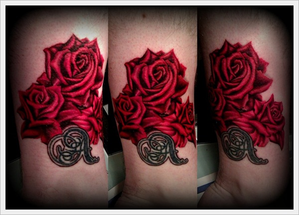 Bunch of red roses tattoo on wrist