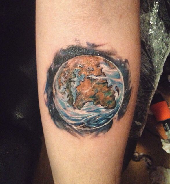 Colored 3d earth tattoo on arm