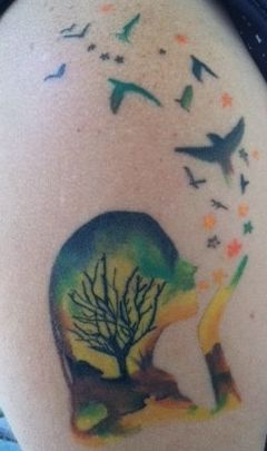 Colored earth mother tattoo with tree and birds on body