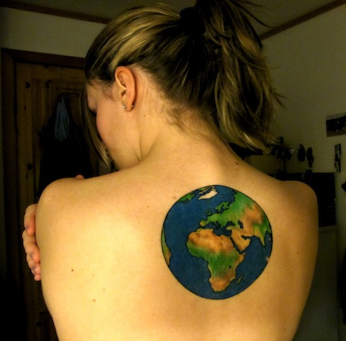 Colored earth tattoo on right upper back for women
