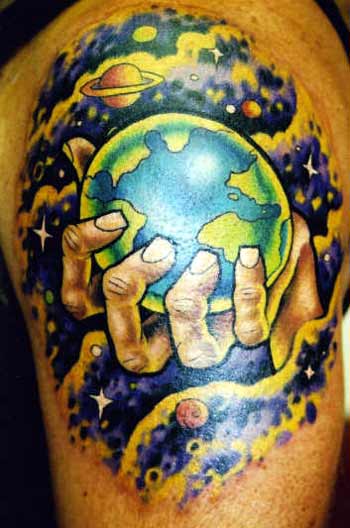 Colored hand holding earth tattoo with planets on arm