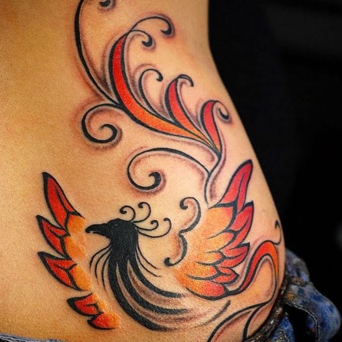 Colorful Phoenix Tattoo On Girl Lower Side Back