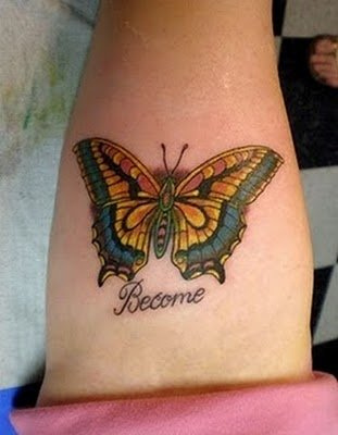 Colorful butterfly tattoo design on inner arm