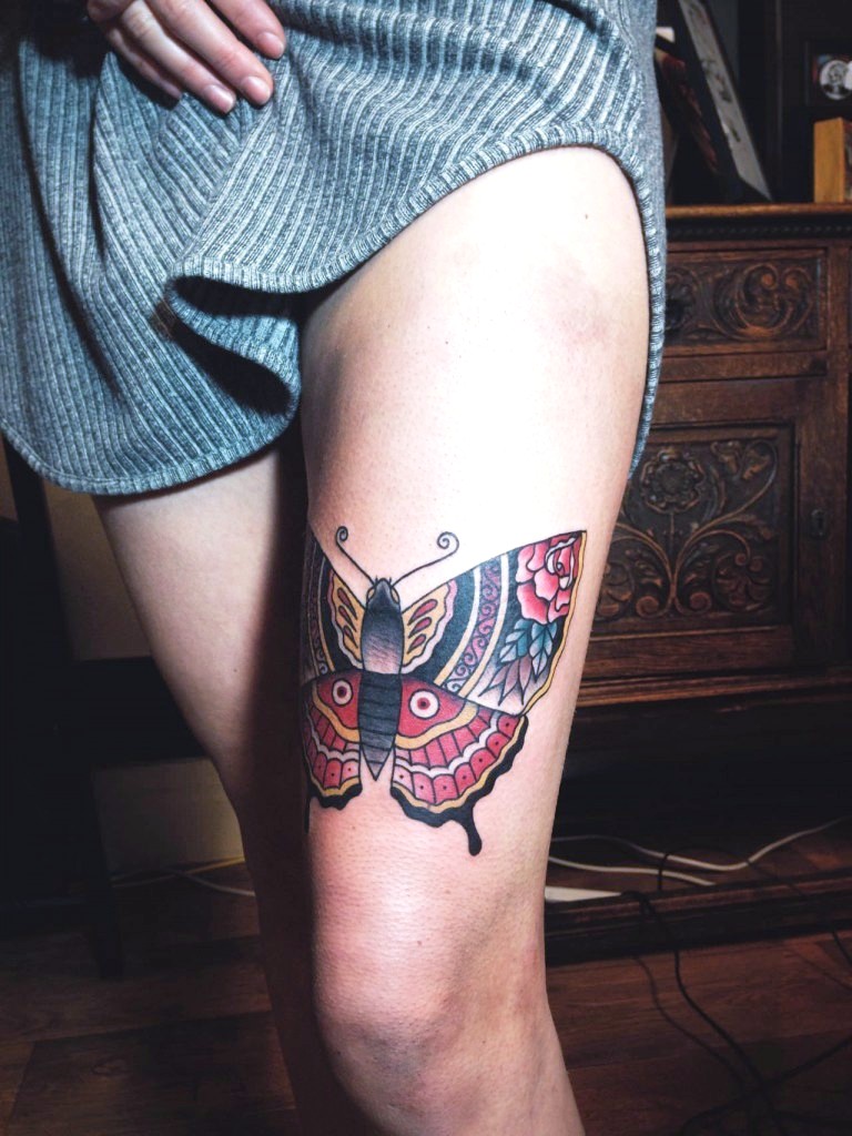 Colorful butterfly tattoo design on thighs