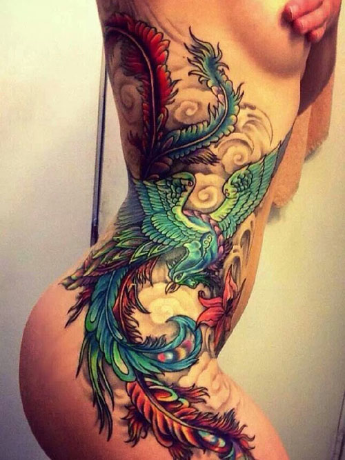Colorful phoenix tattoo on girl side body