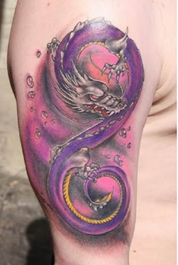 Colorful snake dragon tattoo on right upper arm