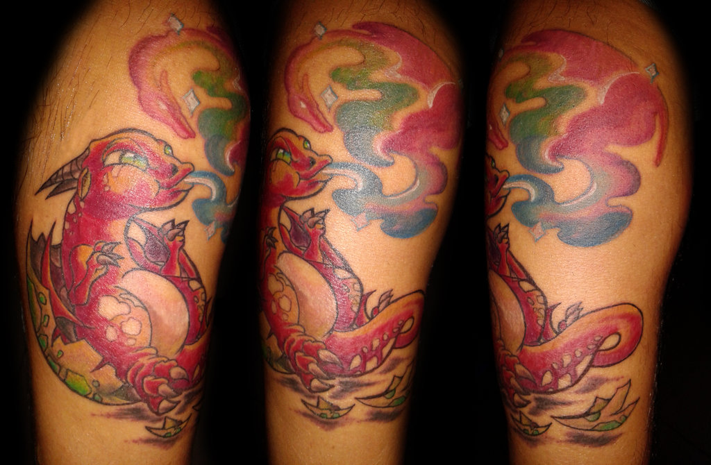 Colored baby dragon tattoo on arm