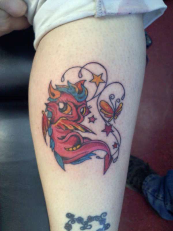 Colored innocent baby dragon tattoo with stars and butterfly on inner arm