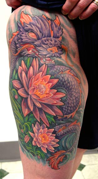 Colourful dragon flower tattoo on inner arm for women