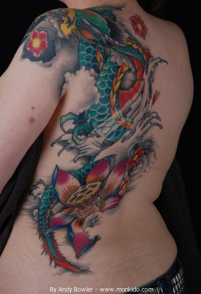 Colourful dragon flower tattoo on left full back and arm for women