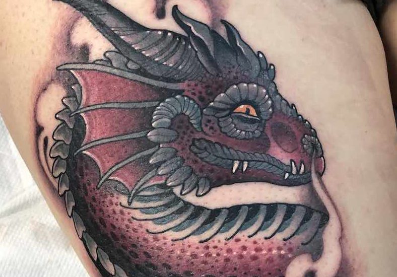 Dragon face tattoo by Jean Le Roux