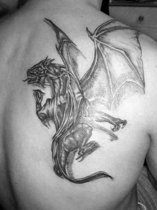 Fantastic full dragon with wings and tail tattoo on back