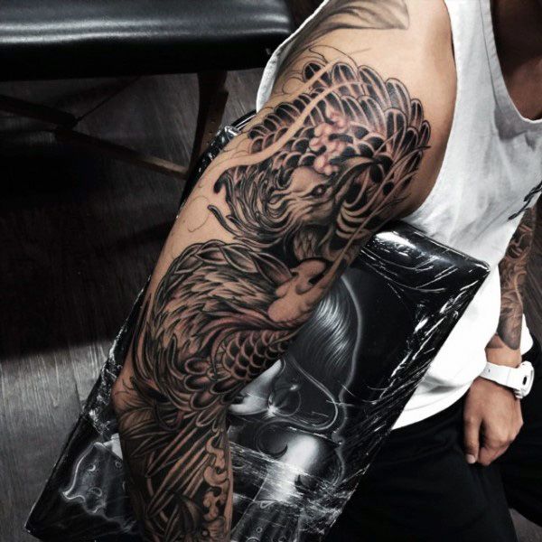 Full sleeve black ink phoenix tattoo for men