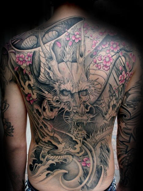 Grey Ink Realistic Dragon & Flowers Tattoo On Men’s Full Back