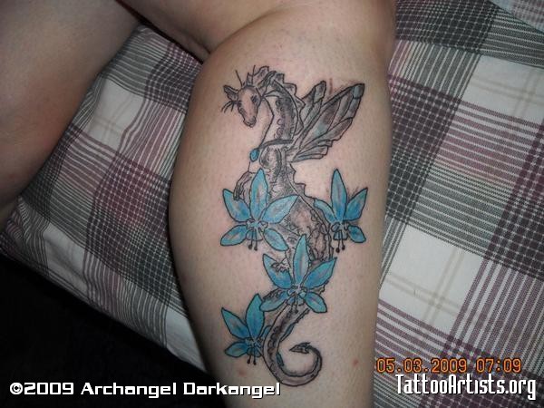 Grey ink dragon with blue flowers leg tattoo for girls