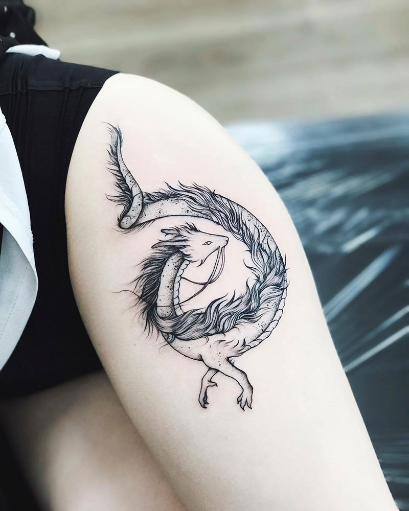 Grey ink unique girly dragon tattoo on thigh