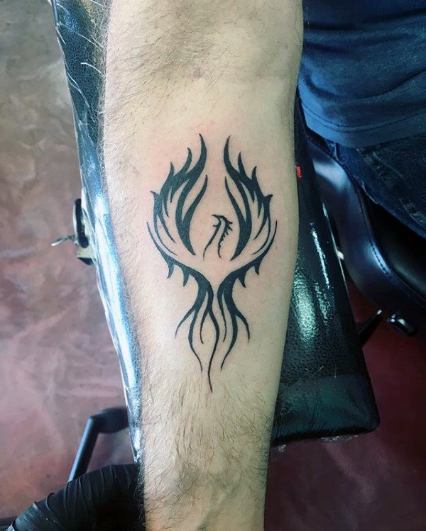 Inner forearm small black ink rising phoenix tattoo for men