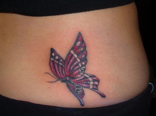 Maroon butterfly tattoo on waist
