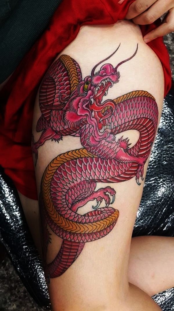 Maroon dragon tattoo on left leg