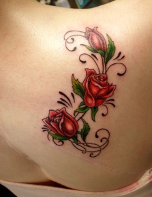 Old school red roses tattoo on women back shoulder