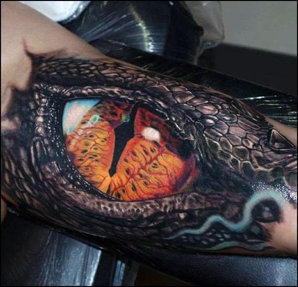 Realistic Dragon eye tattoo on arm