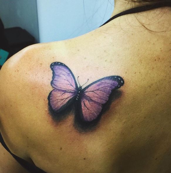 Realistic purple butterfly tattoo on shoulder