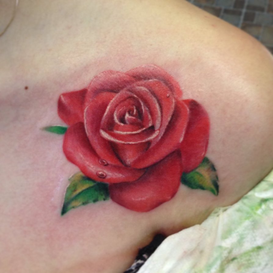 Simple realistic red rose tattoo on women front shoulder