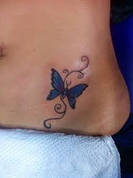 Small blue butterfly tattoo design on left front waist